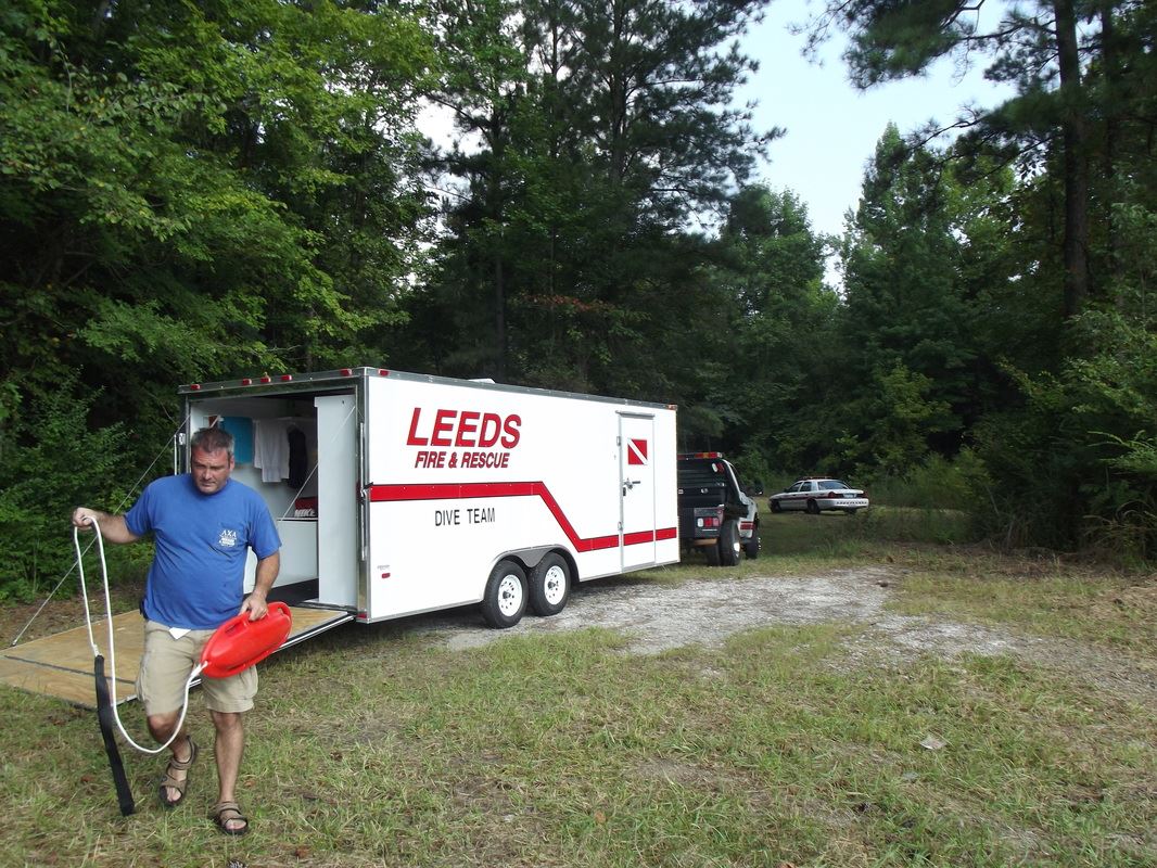 Diver Moving Away From Diver's Truck