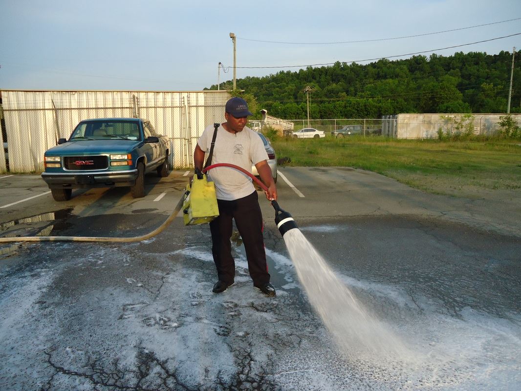 Person Cleanng the Road